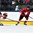 GRAND FORKS, NORTH DAKOTA - APRIL 14: Switzerland's Nico Hischier #13 chases the puck while Latvia's Valters Apfelbaums #7 defends during preliminary round action at the 2016 IIHF Ice Hockey U18 World Championship. (Photo by Matt Zambonin/HHOF-IIHF Images)


